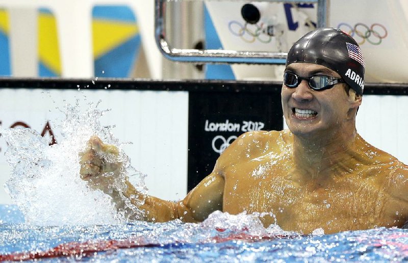 United States' Nathan Adrian celebrates after winning the men's 100-meter freestyle swimming final at the Aquatics Centre in the Olympic Park during the 2012 Summer Olympics in London, Wednesday, Aug. 1, 2012. (AP Photo/Matt Slocum)