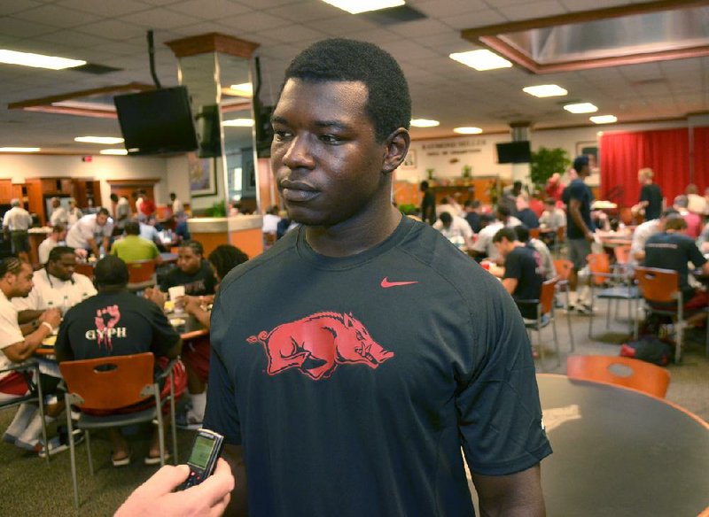 University of Arkansas football player Otha Peters talks to reporters during the Razorbacks team dinner at the Raymond Miller Room at the Broyles Complex at the University of Arkansas in Fayetteville.
