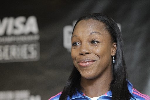 Veronica Campbell-Brown of Jamaica smiles during a press conference in advance of the U.S. Open Track and Field Championships in New York, Thursday, Jan. 26, 2012. (AP Photo/Kathy Willens)