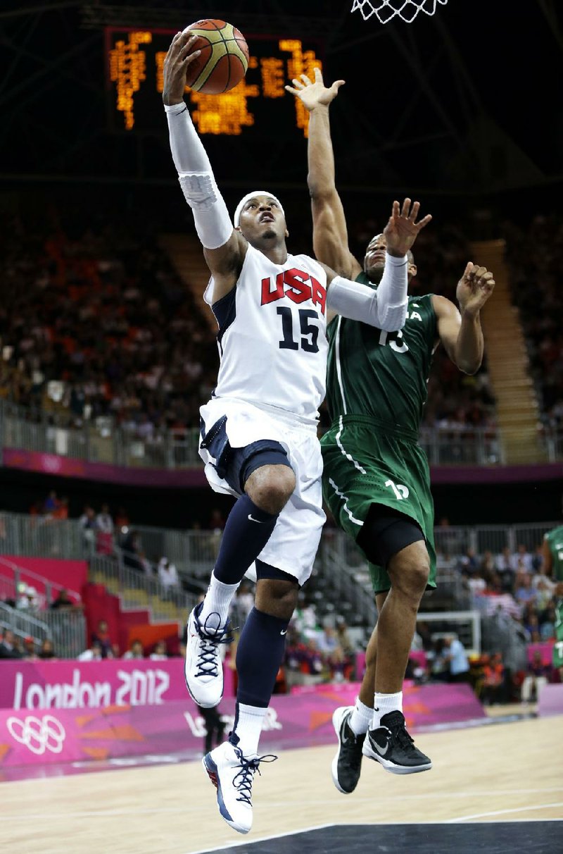 U.S. forward Carmelo Anthony (15) scored 37 points to lead the American team to a record breaking 156-73 victory over Nigeria during Thursday’s game in London. Anthony set the U.S. Olympic record for points in a game in three quarters. 