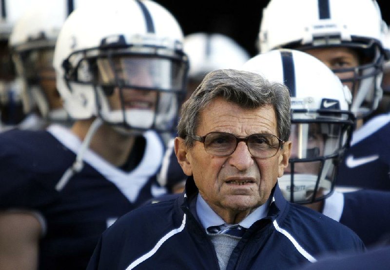 FILE - In this Nov. 7, 2009, file photo, Penn State Coach Joe Paterno stands with his players before taking the field for an NCAA college football game against Ohio State in State College, Pa. Paterno and other senior Penn State officials "concealed critical facts" about Jerry Sandusky's child abuse because they were worried about bad publicity, according to an internal investigation into the scandal released Thursday, July 12, 2012. (AP Photo/Carolyn Kaster, File)