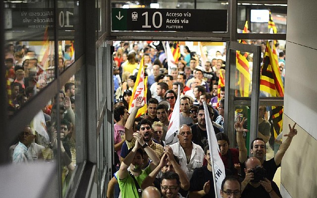 Rail workers protest the government’s privatization plans Friday in Barcelona as Spain continues to deal with its debt crisis. 