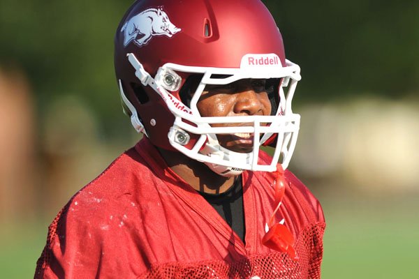 Arkansas fullback Kiero Small, who spent most of the 2011 season as a blocker, could play defense this year, Coach John L. Smith said. Video available at arkansasonline.com/videos. 