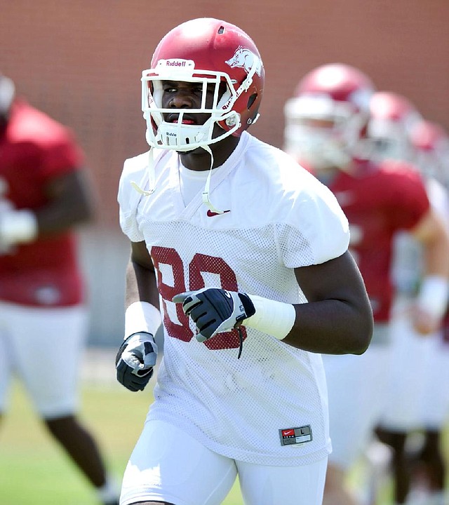 Arkansas defensive end Brandon Lewis, a two-sport athlete in high school, decided to concentrate on football on the advice of his coach.

