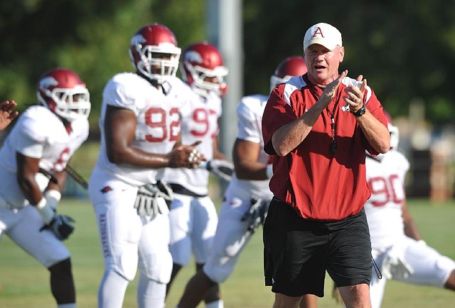 Arkansas strength and conditioning coach Jason Veltkamp helped break up a fight between Mitch Smothers and Darius Pilon on Monday during the Razorbacks’ practice. 