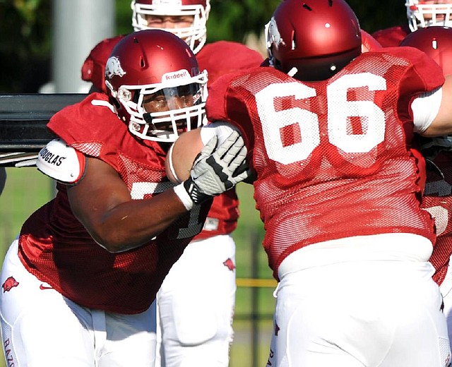 Offensive tackle Jason Peacock is the only one of six Arkansas players arrested in the spring to make it back for fall practice. 