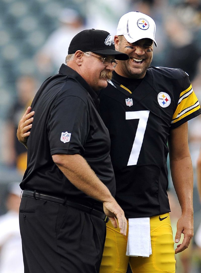 Philadelphia Coach Andy Reid talks with Pittsburgh quarterback Ben Roethlisberger before Thursday night’s preseason game in Philadelphia. The game was two days after a funeral for Reid’s oldest son, who was found dead Sunday at the Eagles’ training camp. 