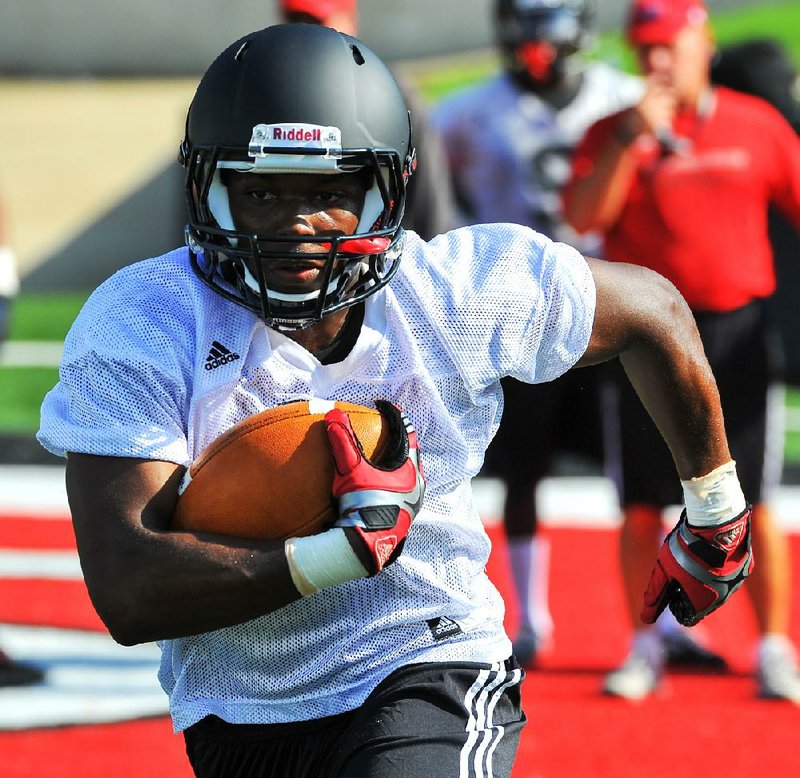 Arkansas State running back David Oku is getting a second chance at college football after leaving Tennessee in 2011. Oku, a top prospect in 2009, began talking with ASU Coach Gus Malzahn in the spring and signed with the Red Wolves in the summer. 