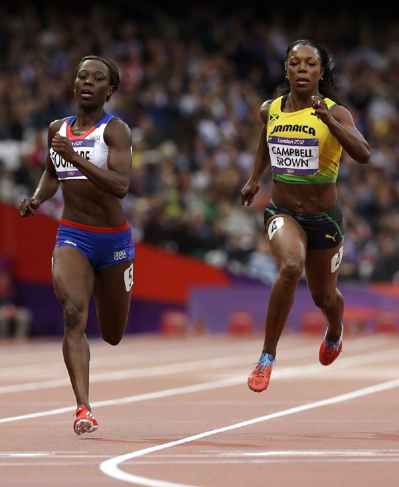 Former Arkansas Razorback sprinter Veronica Campbell-Brown (right) won a silver medal as part of Jamaica’s 400 relay team and a bronze medal in the 100 meters during the Olympic games in London. Campbell-Brown was the only athlete with Arkansas ties to take home more than one medal. 