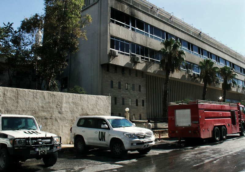 The Dama Rose Hotel is seen after a bomb attached to a fuel truck exploded where U.N. observers often stay in Damascus, Syria, on Wednesday, Aug. 15, 2012.