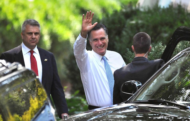 Republican presidential candidate Mitt Romney leaves a fundraiser in Charlotte, N.C., on Wednesday Aug. 15, 2012. 