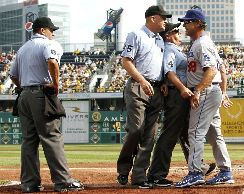 Los Angeles Dodgers Manager Don Mattingly was ejected in the second inning of Thursday’s game after arguing with umpires about the ejection of center fielder Matt Kemp, who was thrown out after he encouraged one of his teammates at the plate. 