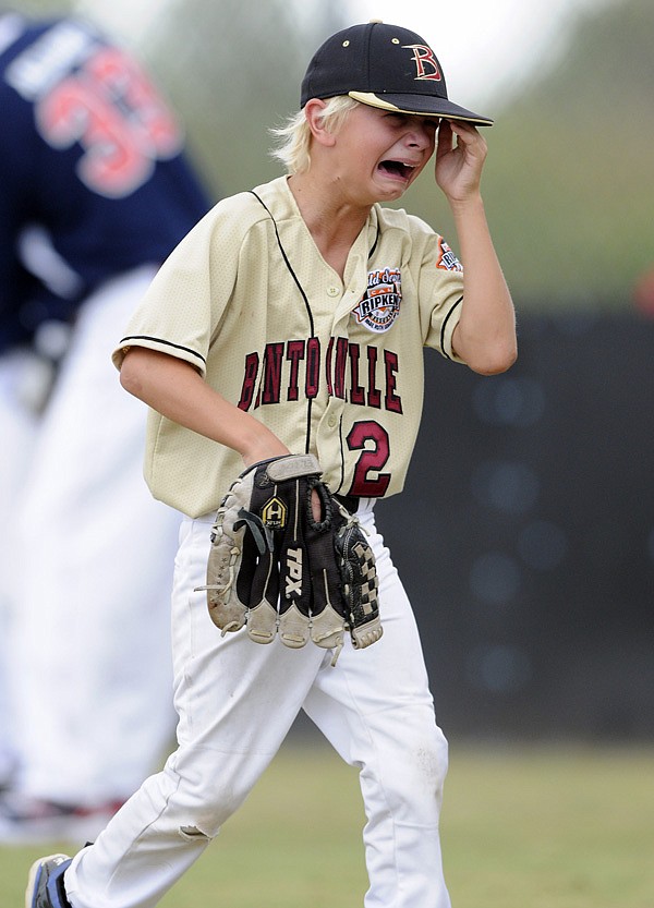 Sam Many of Bentonville is overcome Friday after getting pulled from the mound during the fifth inning of the All-Stars’ semifinal game against Willamette Valley, Ore., in the Cal Ripken World Series in at Memorial Park in Bentonville. Willamette Valley won 11-5. 