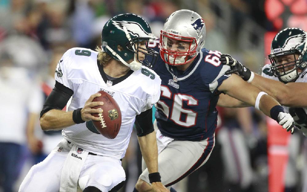 New England Patriots defensive end Jake Bequette (66) chases Philadelphia Eagles quarterback Nick Foles (9) during the second quarter of an NFL preseason football game in Foxborough, Mass., Monday, Aug. 20, 2012.(AP Photo/Steven Senne)