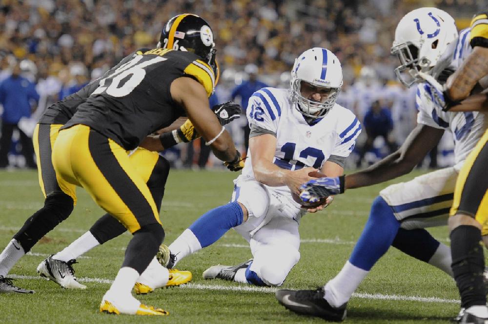 Indianapolis Colts quarterback Andrew Luck (12)tries for the end zone in front of Pittsburgh Steelers defensive back Will Allen (26) in the second quarter of the NFL football preseason game on Sunday, Aug. 19, 2012 in Pittsburgh. (AP Photo/Don Wright)