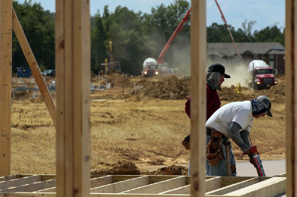 Arkansas Democrat-Gazette/BENJAMIN KRAIN --8/20/2012--
George Gonzalez, left, and Mario Gonzalez work on framing the club house of a new 400 unit apartment complex on Counts Massie Rd. in North Little Rock near Maumelle.