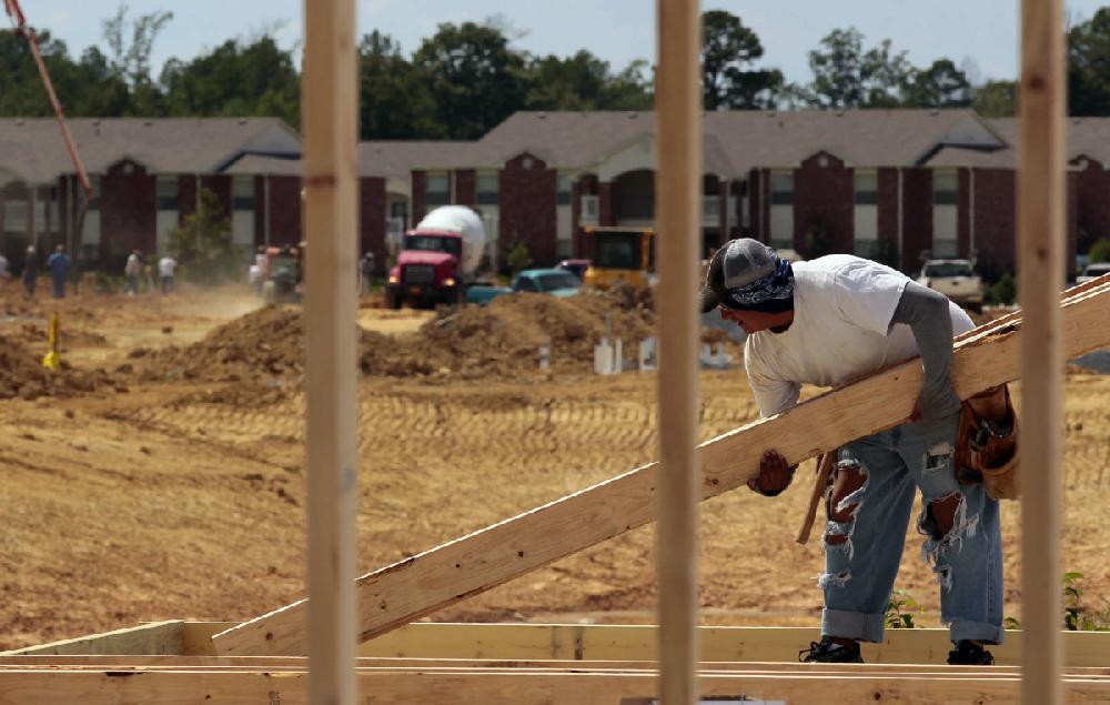 Arkansas Democrat-Gazette/BENJAMIN KRAIN --8/20/2012--
Mario Gonzalez works on framing the club house of a new 400 unit apartment complex on Counts Massie Rd. in North Little Rock near Maumelle.