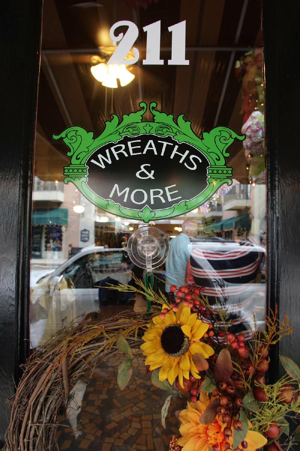 News-Times/Michael OrrellCash mob: Over twenty-five people mobbed Wreaths and More in downtown El Dorado at the start of Main Street El Dorado ash Mobon Thursday afternoon. The cash mob was put together to help provide an economic boost for local retail shops downtown.