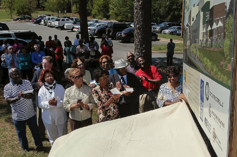 Arkansas Democrat-Gazette/BENJAMIN KRAIN --8/20/2012--
Little Rock city officials and University Park Neighborhood residents applaud during an unveiling and groundbreaking ceremony for Little Rock’s new community center in the University Park neighborhood. The Centre at University Park will be a modern and useful replacement for the former Adult Leisure Center building that burned down in 2009. The new Center will be approximately 15,000 square feet, with a larger ball room, meeting rooms, webinar room, pottery and crafts room at a cost of approximately $3,000,000 funded by insurance proceeds and recently passed tax measure. The construction time is expected to be eight months.
