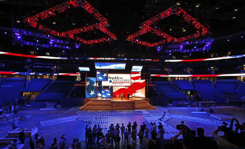 Republican National Committee Chairman Reince Priebus, left, and convention CEO William Harris unveil the stage and podium for the 2012 Republican National Convention, Monday, Aug. 20, 2012, at the Tampa Bay Times Forum in Tampa, Fla. (AP Photo/Scott Iskowitz)