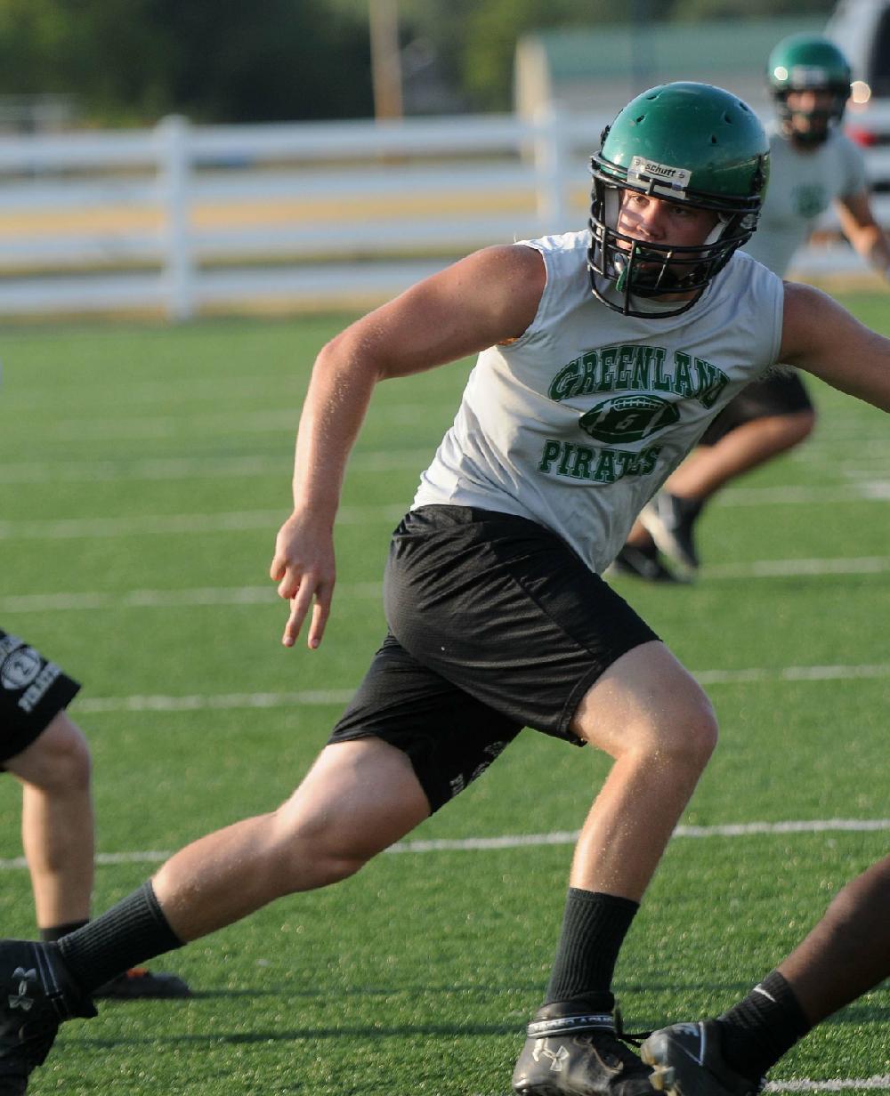 STAFF PHOTO SAMANTHA BAKER
Kellin Lee of Greenland High School follows the ball Monday, July 9, 2012, during 7-on-7 scrimmage at Springdale Har-Ber High School.