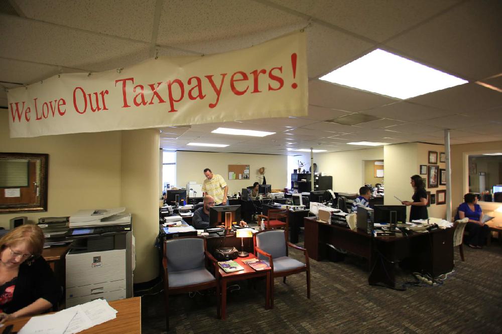 Arkansas Democrat-Gazette/RICK MCFARLAND --08/20/12-- Employees at the Pulaski County Tax Assessor ofice were busy Monday answering phone calls from home owners and businesses concerning their property appraisals. Monday was the last day to file an appeal.