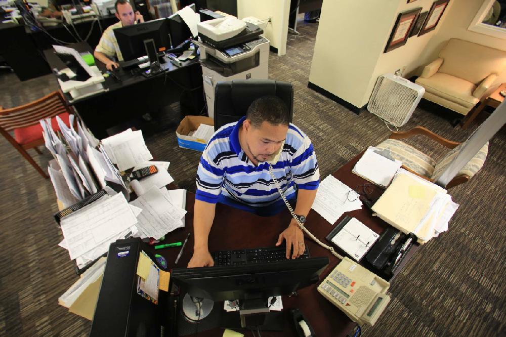 Arkansas Democrat-Gazette/RICK MCFARLAND --08/20/12-- Ben Giles at the Pulaski County Tax Assessor office answers phone calls from home owners and businesses concerning their property appraisals. Monday was the last day to file an appeal.