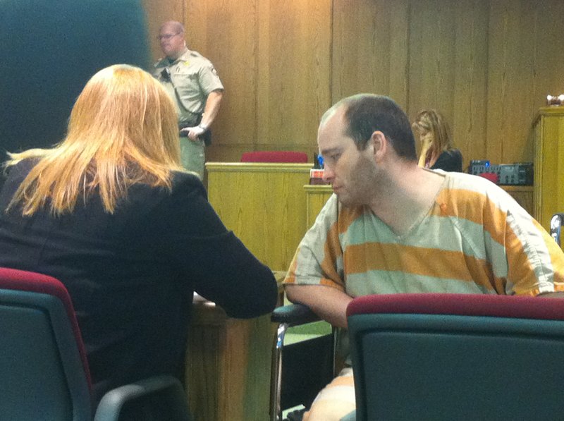 Nathan Chism, 32, speaks with his attorney Marianne Hudson before he was sentenced to 45 years in prison Wednesday.