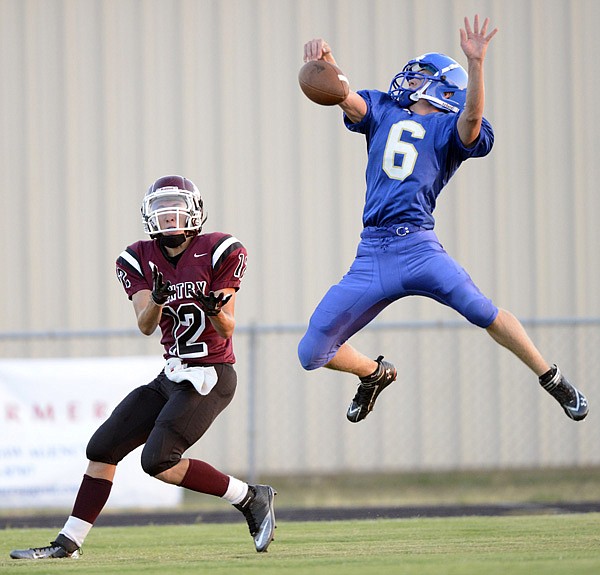 Evan Owens, right, a Decatur defensive back, breaks up a pass to Gentry receiver Stone Faulkenberry during a scrimmage Thursday. 