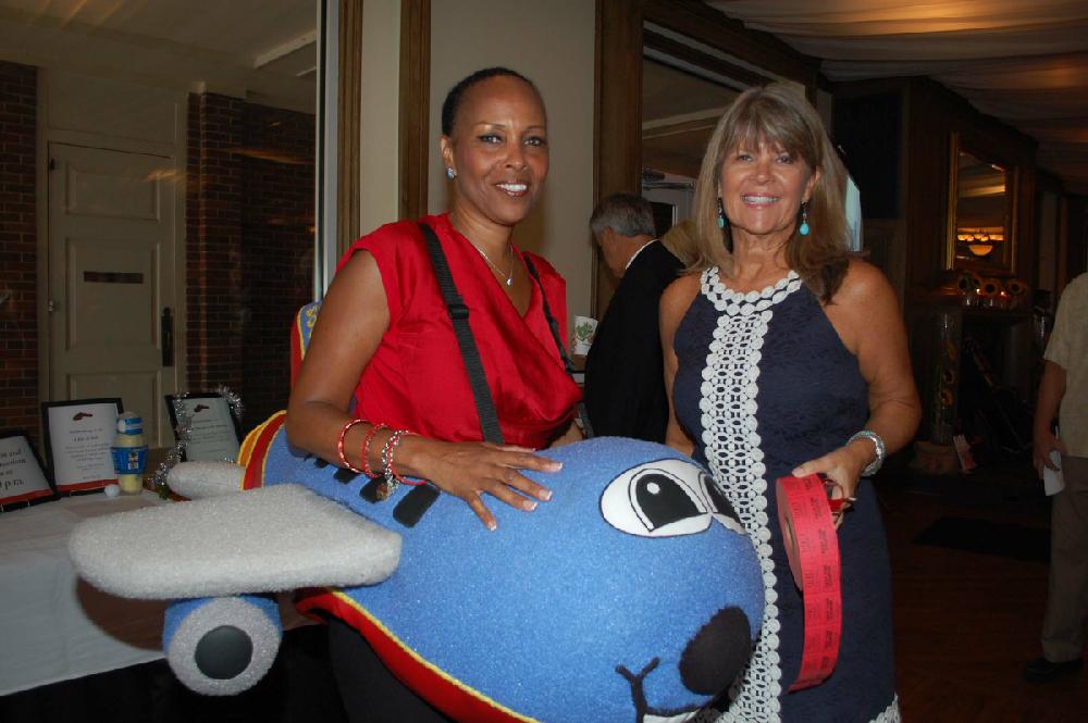 Gwen Haniff, a Ronald McDonald House board member and a representative of Southwest Airlines, and Janell Mason. Southwest donated two roundtrip airline tickets to the live auction.