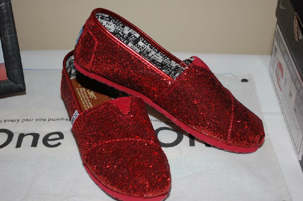 A wall of red shoes were up for auction.