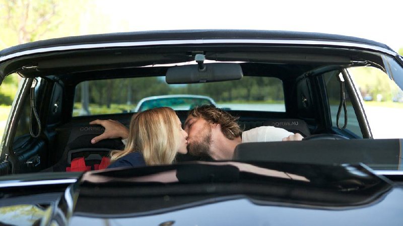 Annie (Kristen Bell) and Charlie Bronson (Dax Shepard) share a tender moment during a brief lull in the action in Hit and Run. 