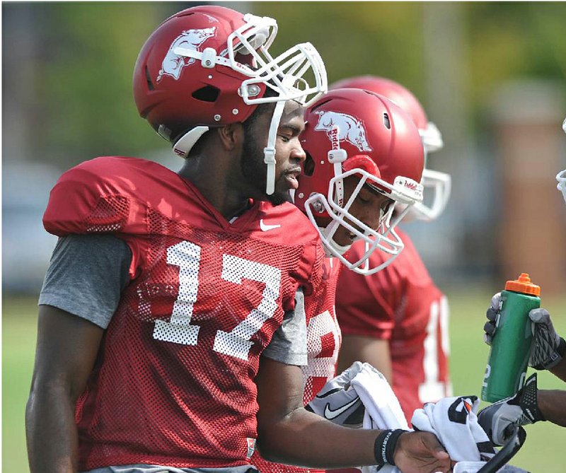 Arkansas junior Brandon Mitchell (17), who was a backup quarterback last season, has moved to the top of the depth chart as a receiver, a move he says “feels great.” 