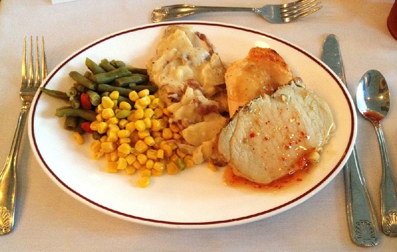 The dinner buffet on the Arkansas Queen includes (clockwise from left): green beans, corn, chicken, scalloped potatoes and pork. 