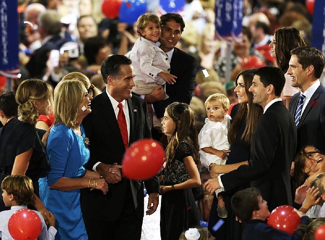 Mitt Romney celebrates after his acceptance speech Thursday night with his family and vice presidential nominee Paul Ryan. 