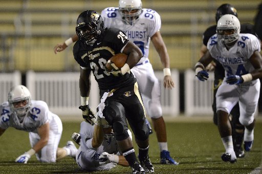 STAFF PHOTO MARC F. HENNING -- Bentonville running back Tearris Wallace breaks away for a big gain on a carry during the third quarter of the Tigers' season opener Friday, Aug. 31, 2012, against Kansas City (Mo.) Rockhurst at Tiger Stadium in Bentonville.