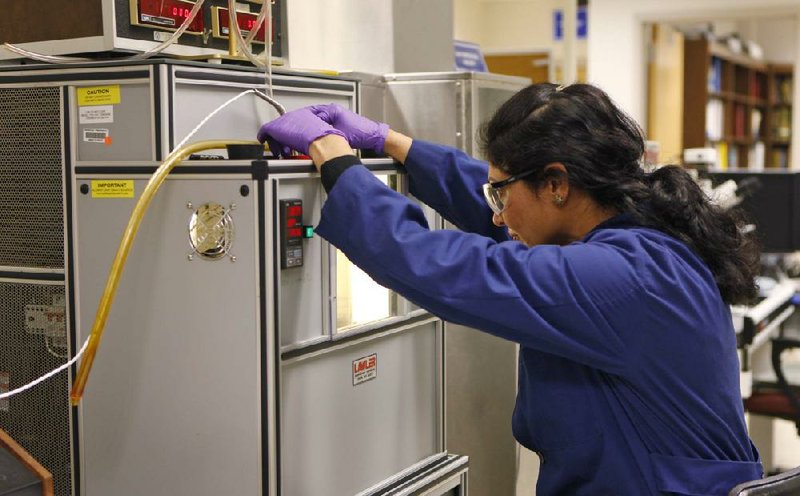 Lab technician Rajul Shah monitors biofuel testing at the Patuxent River Naval Air Station in Patuxent River, Md., in February as part of the military’s efforts to develop nonfossil fuels to power its vehicles. 