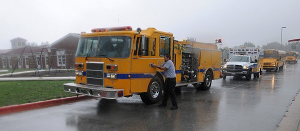 Springdale firefighters from Station 4 respond to a seizure call Aug. 31 at Hunt Elementary in Springdale. Springdale provides ambulance service to Lowell and Bethel Heights in Benton County, but those cities may get a new ambulance service depending on how Benton County officials decide to organize countywide ambulance coverage.