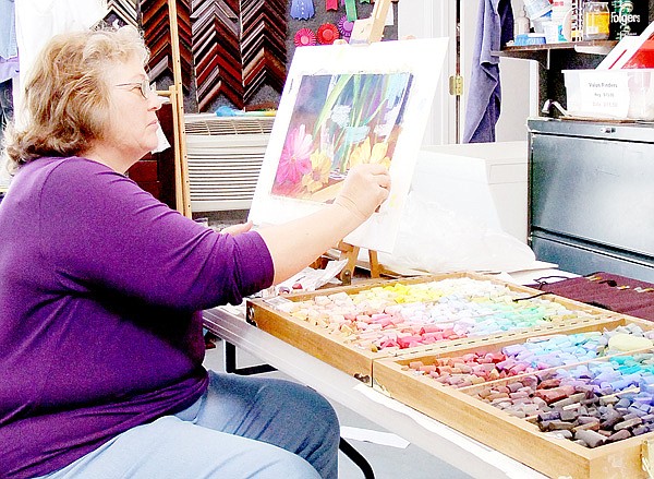 Artist Susan Edgmon demonstrates the type of project students in her “Exploring Pastels” class will complete at NWACC’s Bella Vista Center. Her class begins Sep- tember 24 and is open to anyone with an interest in art.