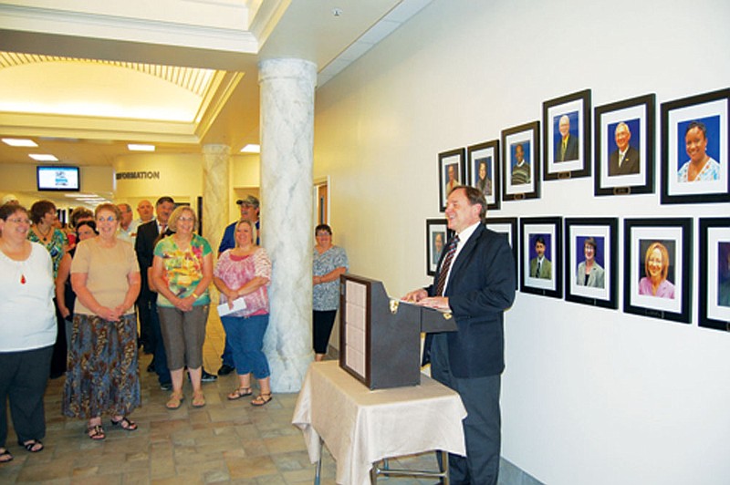 Stephen Schoonmaker, president of College of the Ouachitas, smiles as he tells the faculty that the school is one of 10 finalists for a national award for leading students to success. The award, from the Aspen Institute in Washington, D.C., gives the winning school a share of a $1 million fund.