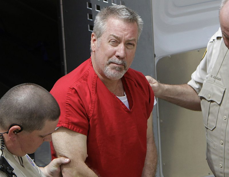 FILE - In this May 8, 2009 file photo, former Bolingbrook, Ill., police sergeant Drew Peterson arrives at the Will County Courthouse in Joliet, Ill., for his arraignment on charges of first-degree murder in the 2004 death of his former wife Kathleen Savio, who was found in an empty bathtub at home. Attorneys will deliver closing arguments at Drew Peterson���s trial Tuesday, after which jurors will begin deliberations on whether the state proved the former Illinois police officer murdered his third wife. The sides make their final pitches after five weeks of testimony about the 2004 death of Kathleen Savio, whose body was found in a dry bathtub of her suburban home outside Chicago with a gash on the back of her head. 