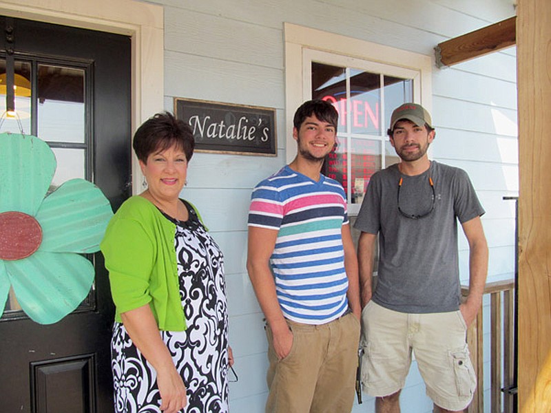 From left, owner Natalie Cox and sons, Cameron, 20, and Cody, 24, stand outside her restaurant on College Street in Batesville.