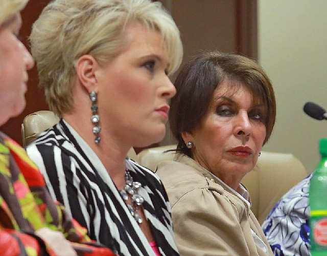 State Treasurer Martha Shoffner, right, listens to Autumn Sanson, her chief investment officer, tell her side of the story at a meeting of the Legislative Joint Auditing Committee on September 17, 2012.