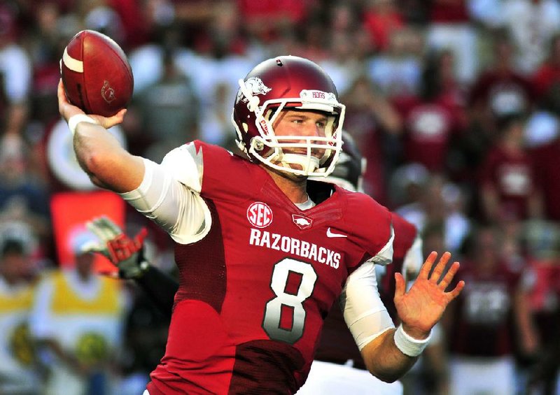 Arkansas quarterback Tyler Wilson passes during the first quarter of an NCAA college football game against  Jacksonville State in Fayetteville, Ark., Saturday, Sept. 1, 2012. (AP Photo/April L. Brown)