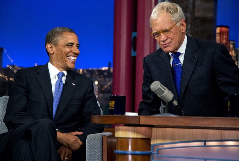 President Barack Obama talks with David Letterman on the set of the "Late Show With David Letterman" at the Ed Sullivan Theater, Tuesday, Sept. 18, 2012, in New York.  (AP Photo/Carolyn Kaster)