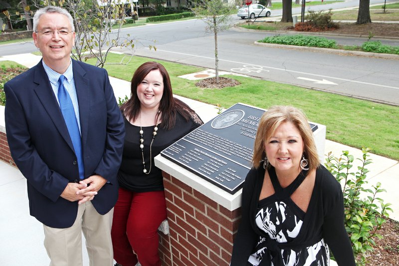 The Brittany Parrish Memorial Garden, on the east side of the new academic building, was dedicated Friday. Brittany, 11, died Nov. 3, 1992, after accidentally ingesting a balloon. Gathered at the plaque dedicated to Brittany are, from the left, her father, Donny Parrish; sister, Samantha; and mother, Datha. Donny is CBC’s coordinator of spiritual life.