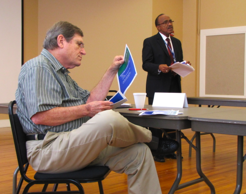 Parks and Recreation Director Truman Tolefree, right, gives a report Wednesday on how the sales tax increase has been spent in his department while LR Cent committee member Donald Shellabarger looks through an accompanying packet.