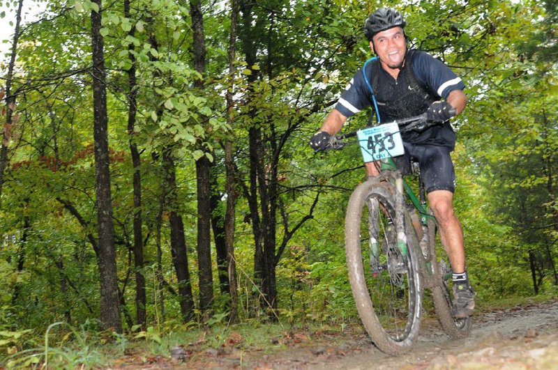 Ian Anderson of Bentonville tops a rise during the race.