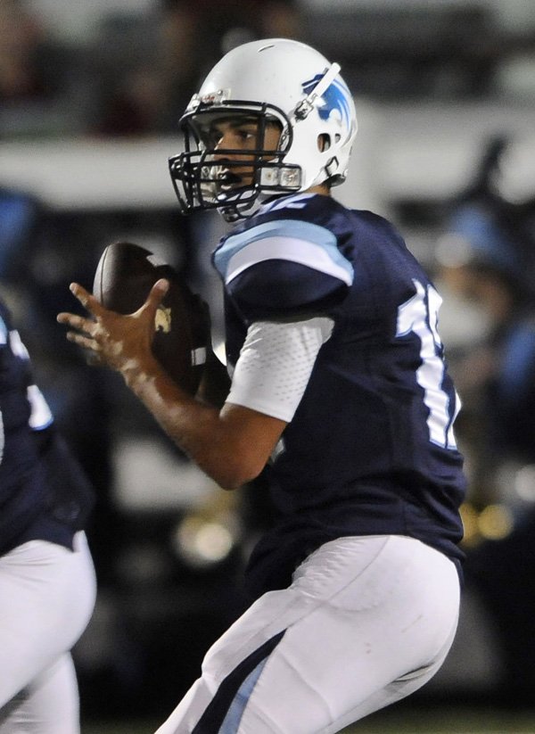 Kyle Pianalto, the Springdale Har-Ber quarterback, drops back to look for a open receiver Friday against Fort Smith Southside at Bulldog Stadium in Springdale.