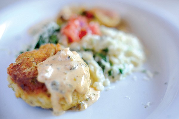 Aquafire’s menu
features Local Trout Cakes, a combination of locally sourced trout, shrimp tartar sauce and spinach risotto. 